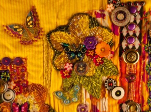 Detail of an art quilt in progress, "Gardens of Yellow and Butterflies"