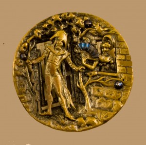 Metal button depicting a gentleman courting a woman with a fan