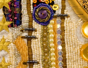 Vertical rows of gold bugle beads in the art quilt, "Feathers and Stars, Stars and Feathers"