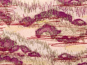 Detail of machine embroidery and lace motifs on paper