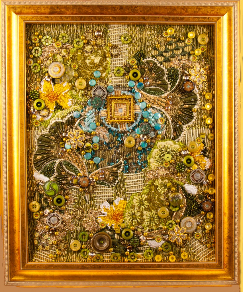 A framed contemporary art quilt embellished with buttons and beads based on tapping into a person's energy field