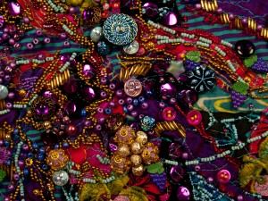 Beads sewn together to look like grape clusters in the art quilt series, "Wines of the World"