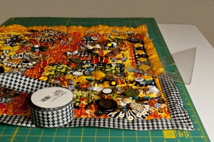 Starting to put the binding on a contemporary beaded art quilt