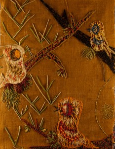Yarn embroidery on burlap background