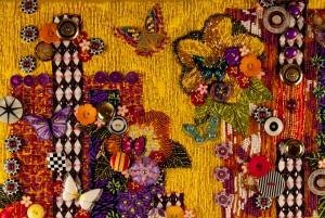 Detail of contemporary, beaded art quilt "Garden of Yellow and Butterflies"