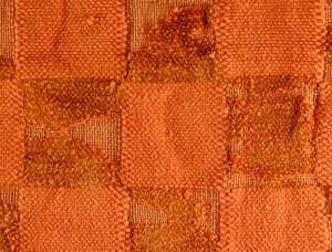 Close-up view of threadbare chenille bathmat