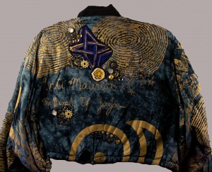 Back of commercial jacket with appliques and button and bead embellishments