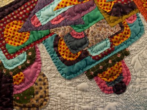 Detail of "Asymmetrical Green Circle" -  a hand appliqued, hand quilted contemporary art quilt