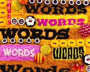 Detail of small beaded art quilt, "Words, Words, Words"